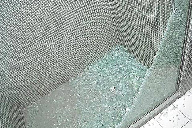 Tempered glass shower door shattered